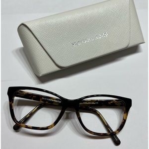 Worn Michael Kors Glasses.